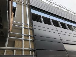 Install exterior metal panel